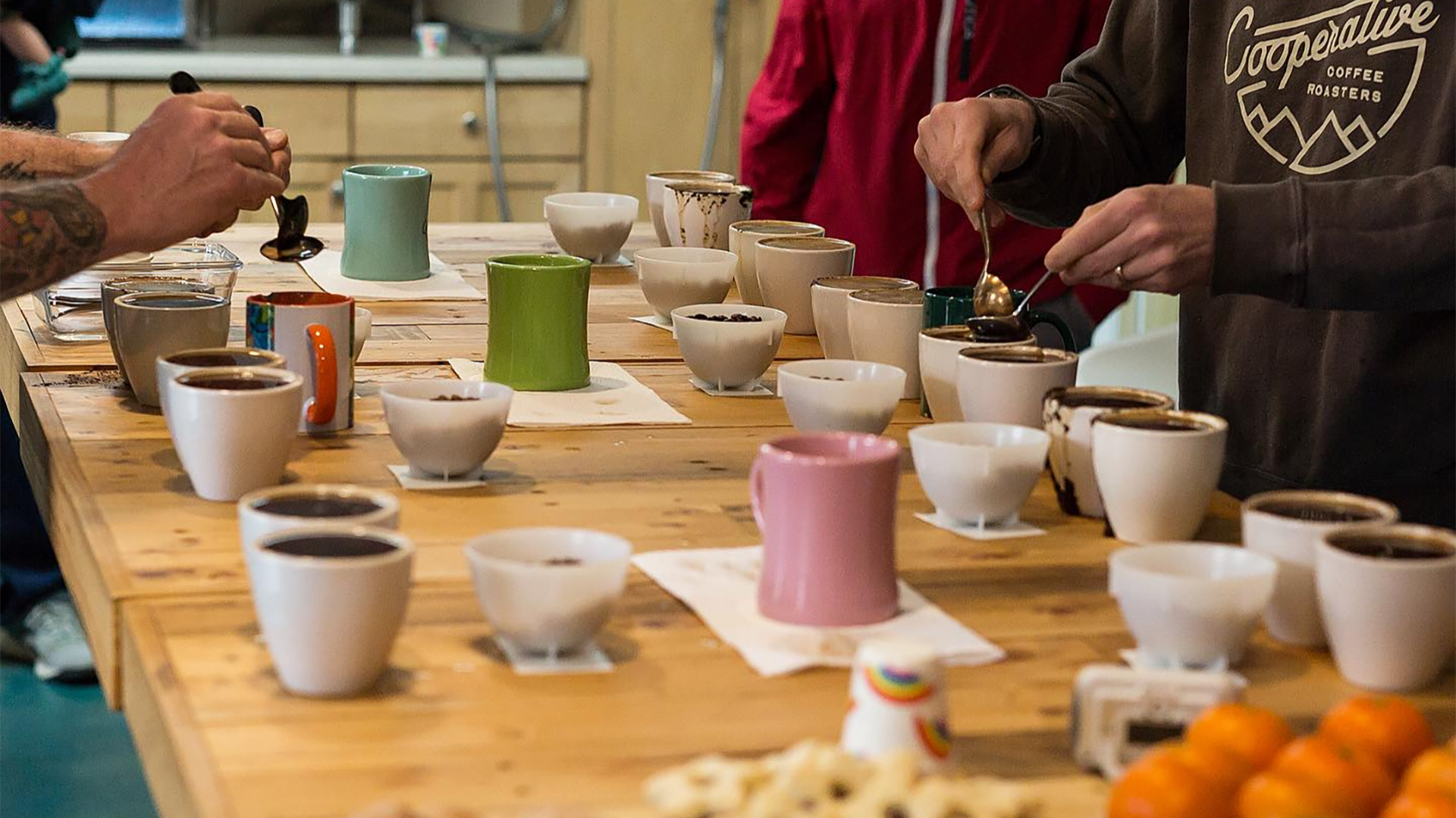 people tasting a variety of coffee